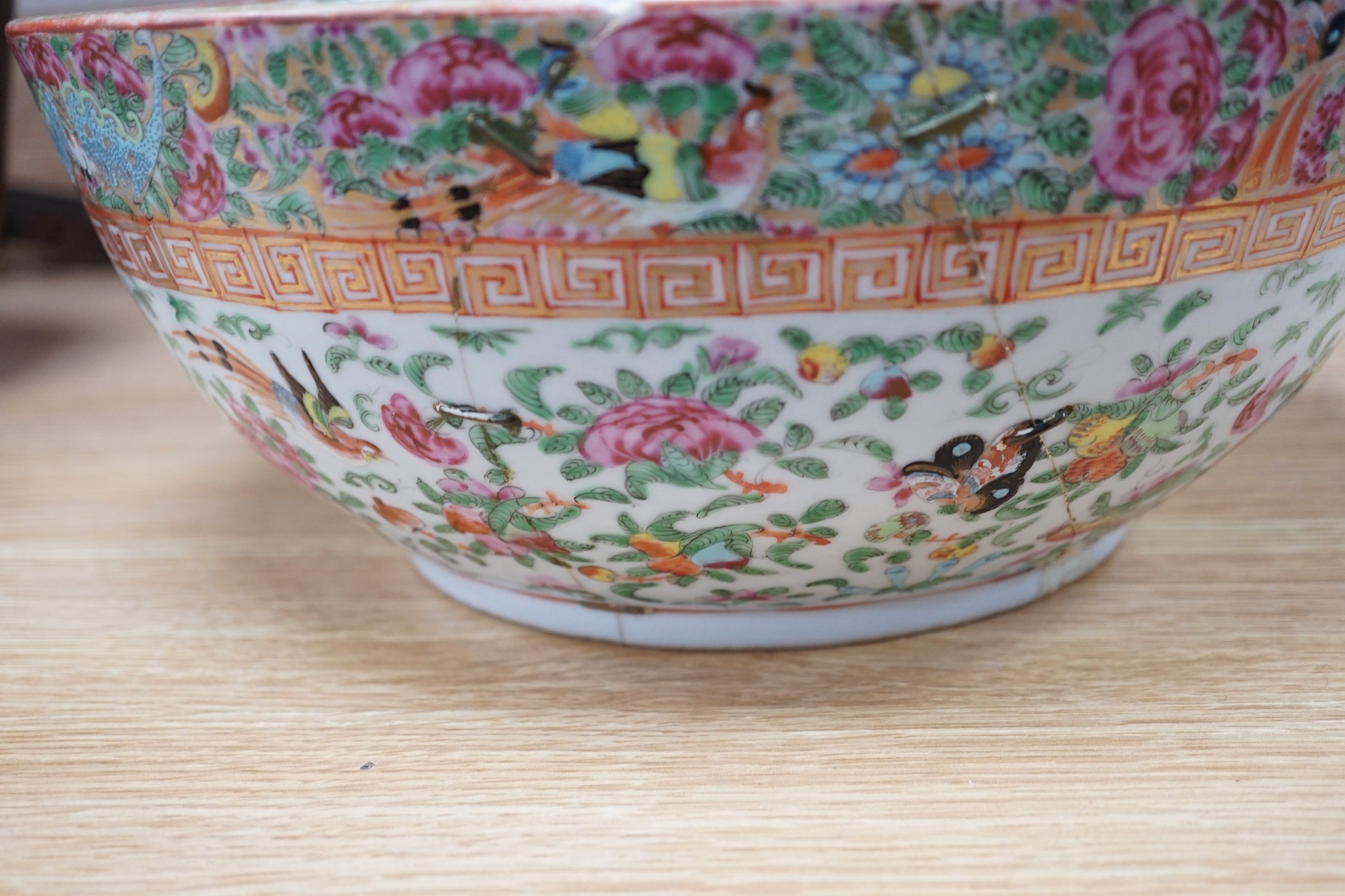 A 19th century Imari bowl, a famille rose bowl and one other- all damaged